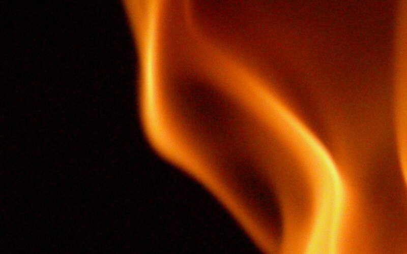 Flame Against Black Background — Orange