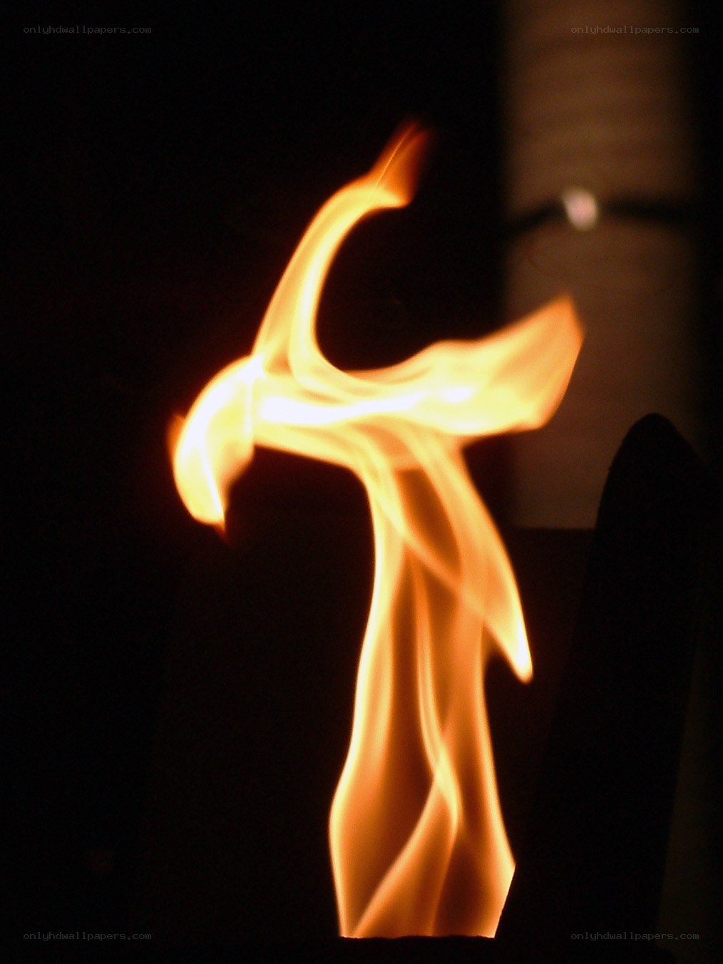 Flame in the shape of a cross