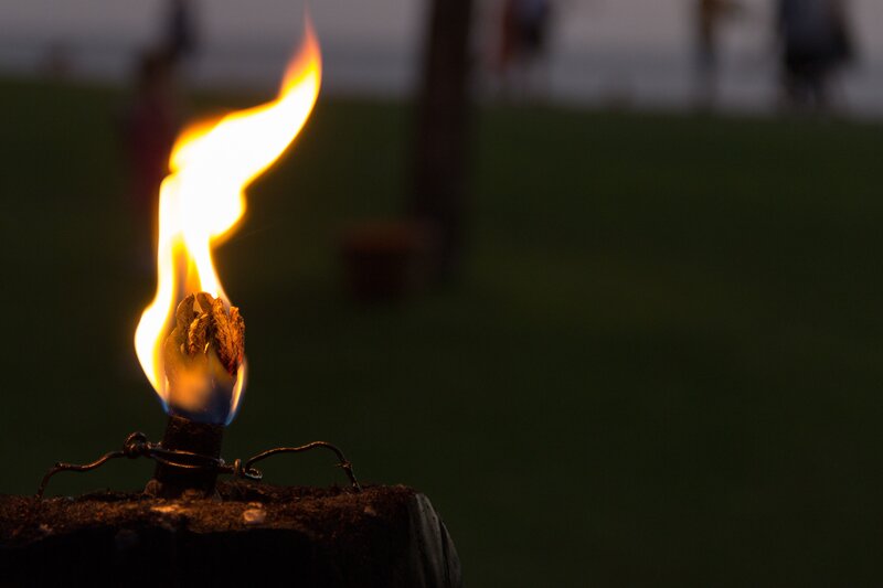 Flame on a wooden post