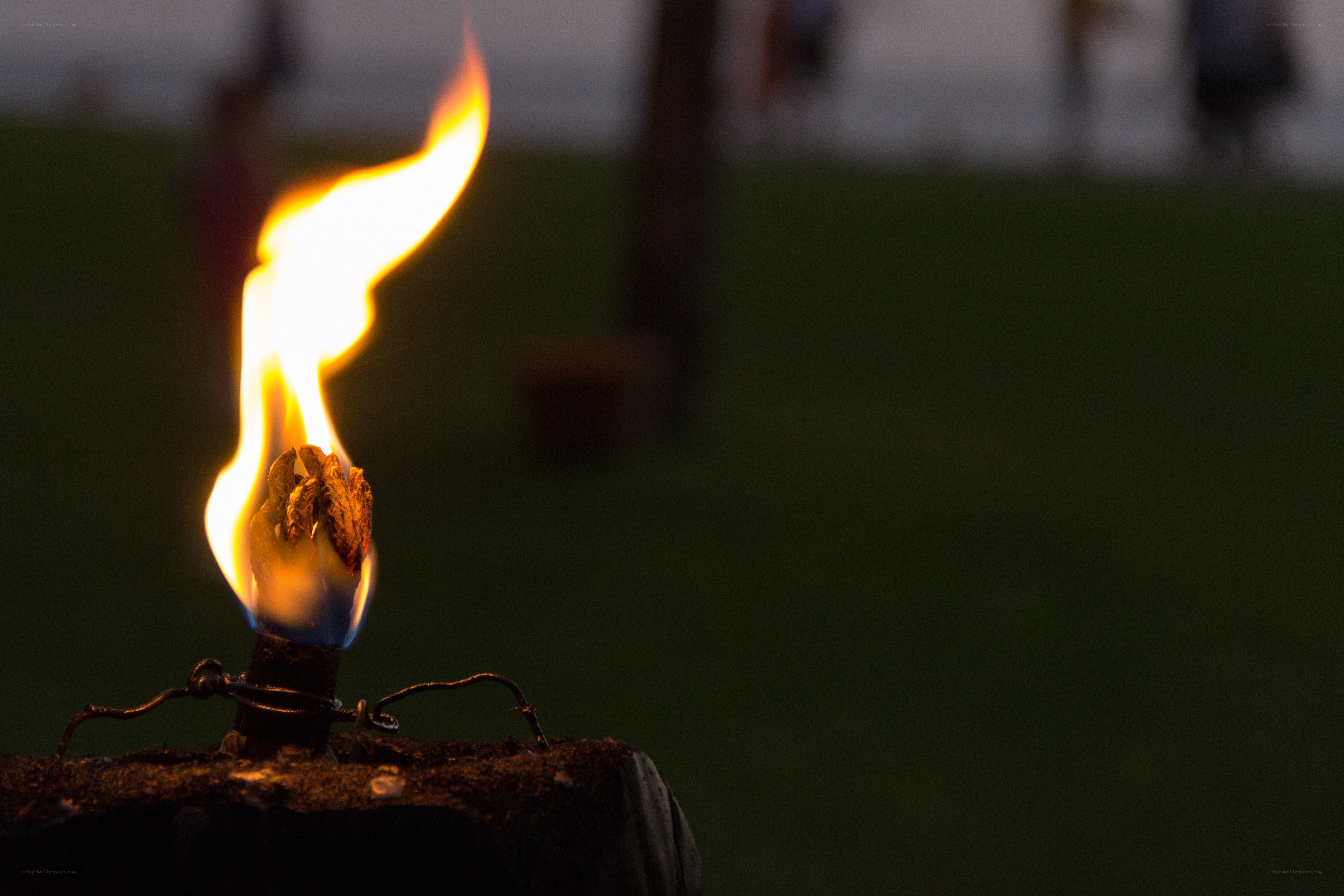 Flame on a wooden post