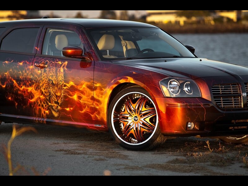 flame-painted car with leopard