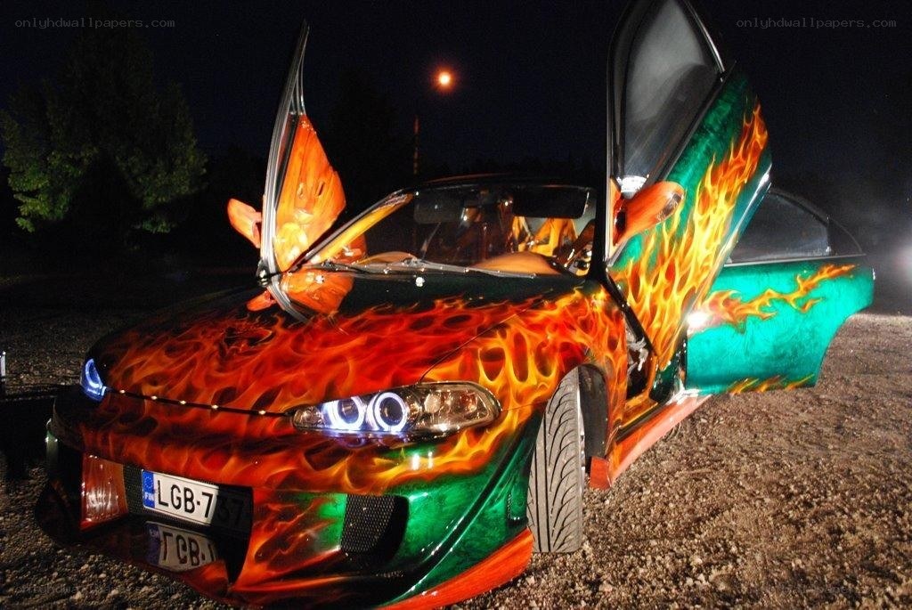 Flame-painted car with open doors