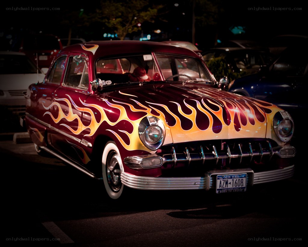 Flame-painted classic car at night