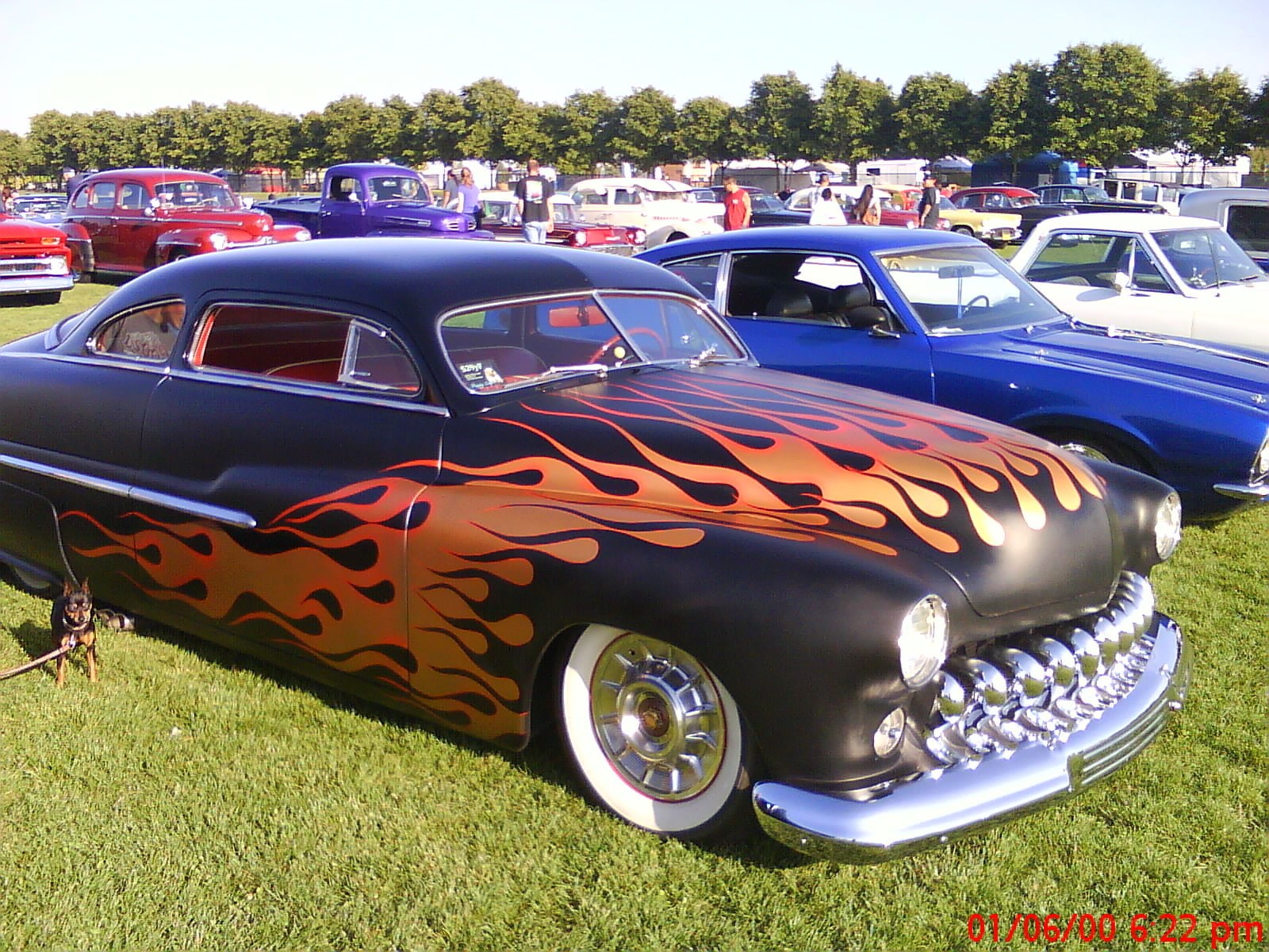 Flame-painted classic car at show