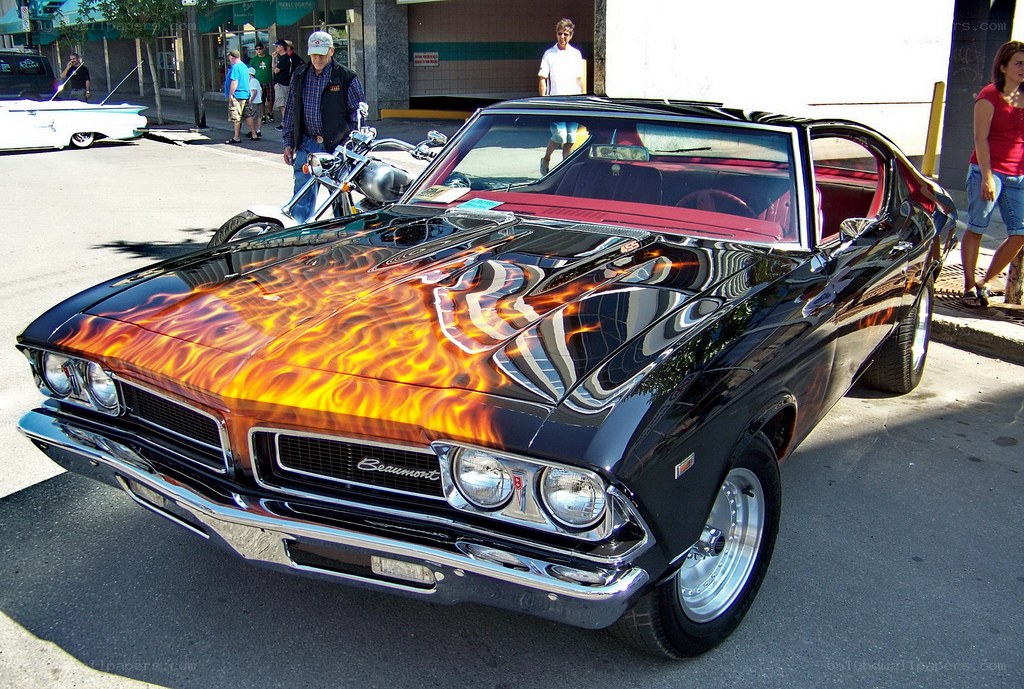 Flame-painted classic car on display