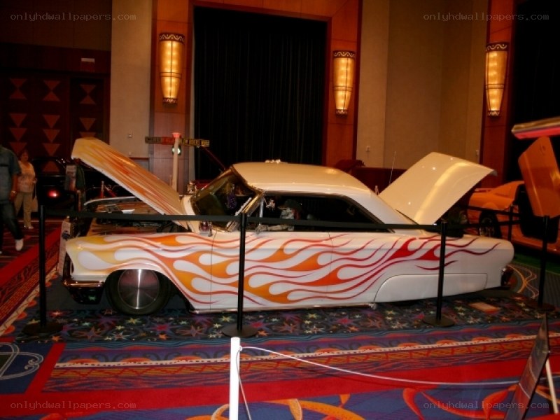 Flame-painted classic car on display