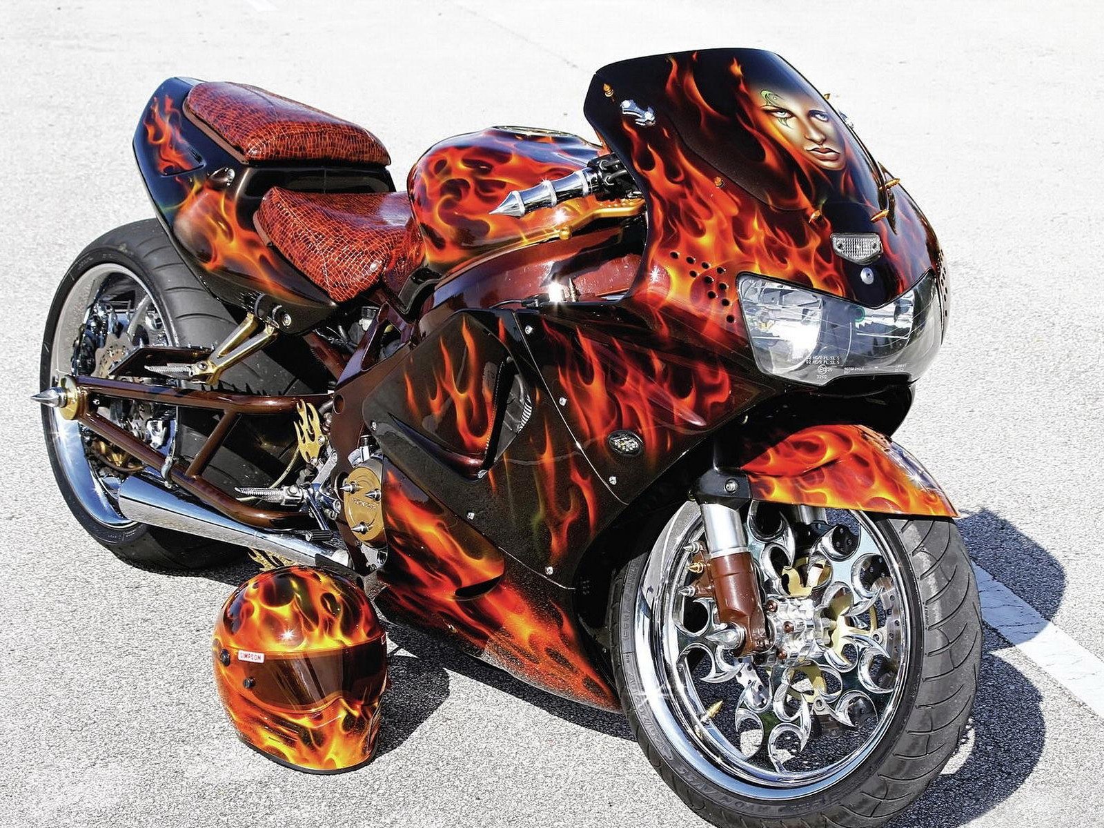 flame-painted motorcycle with helmet