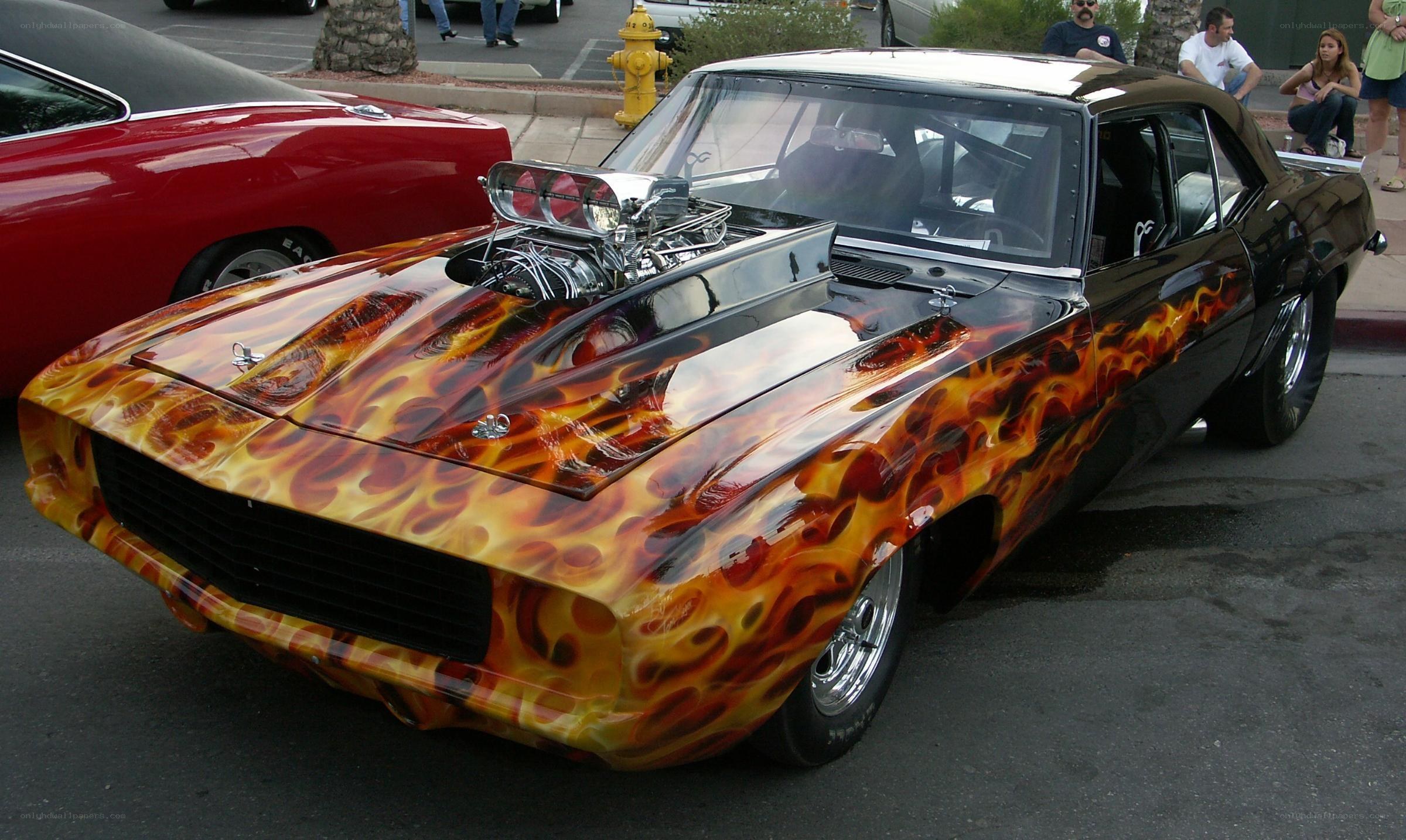 Flame-painted muscle car at show