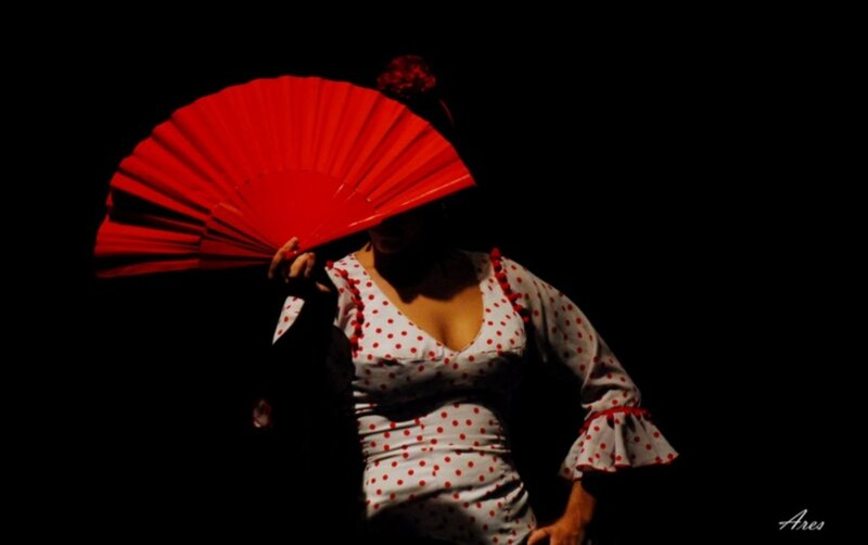 Flamenco dancer with red fan
