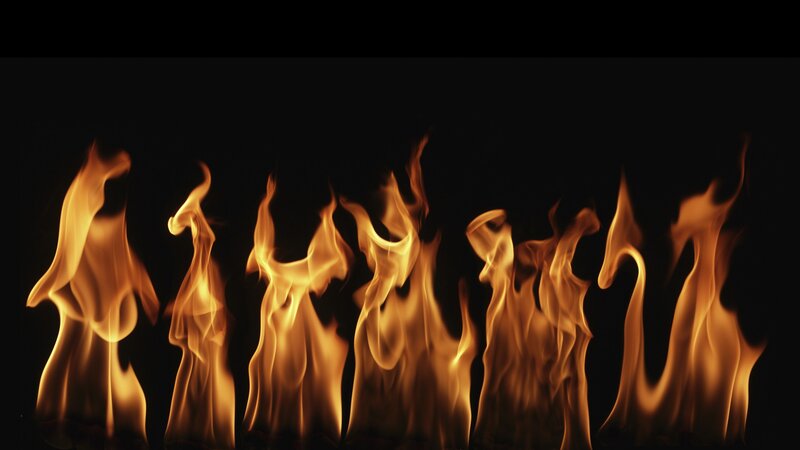 Flames Against Black Background — Dramatic