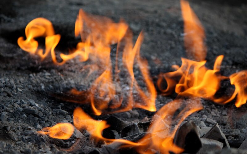 Flames burning on charcoal