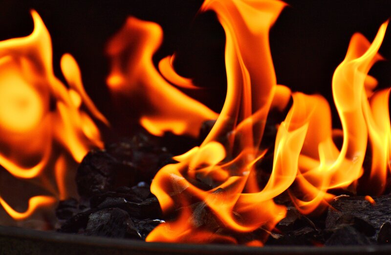 Flames burning on charcoal