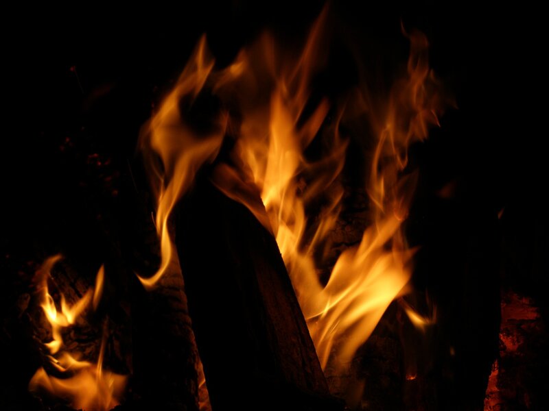 Flames in a dark setting