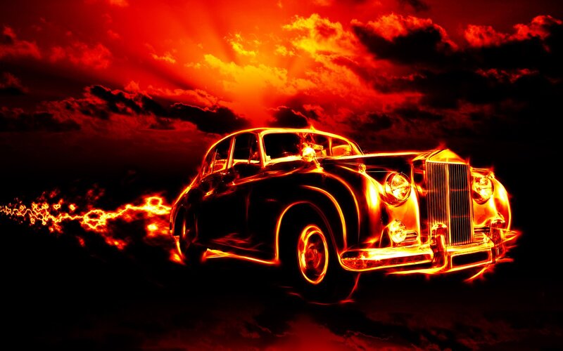Flaming classic car at sunset