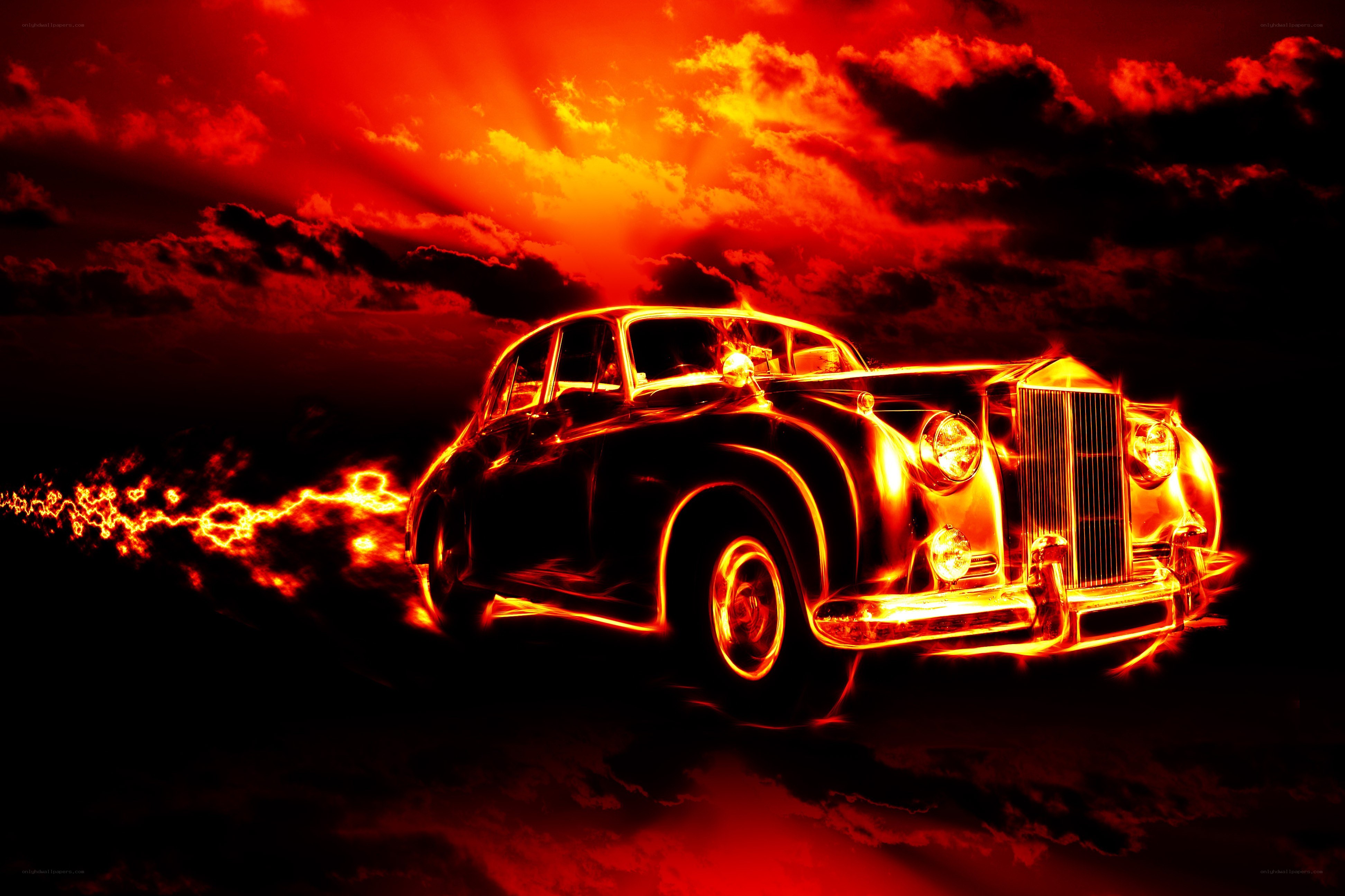 Flaming classic car at sunset