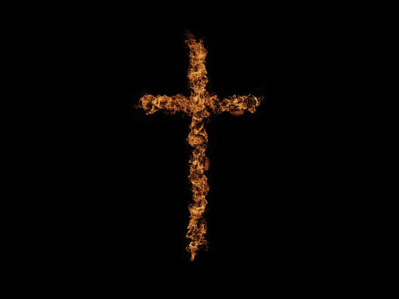 flaming cross on black