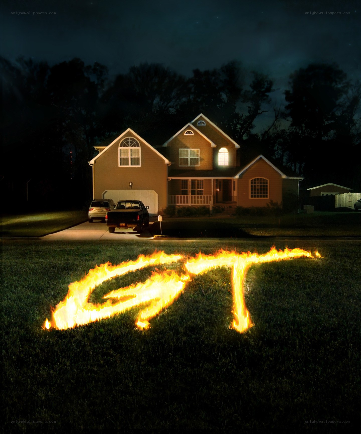 Flaming letters on a lawn at night