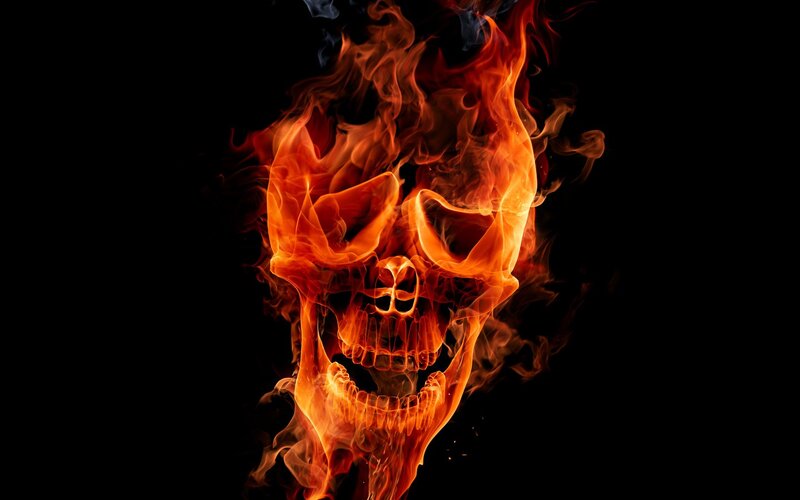 flaming skull on black