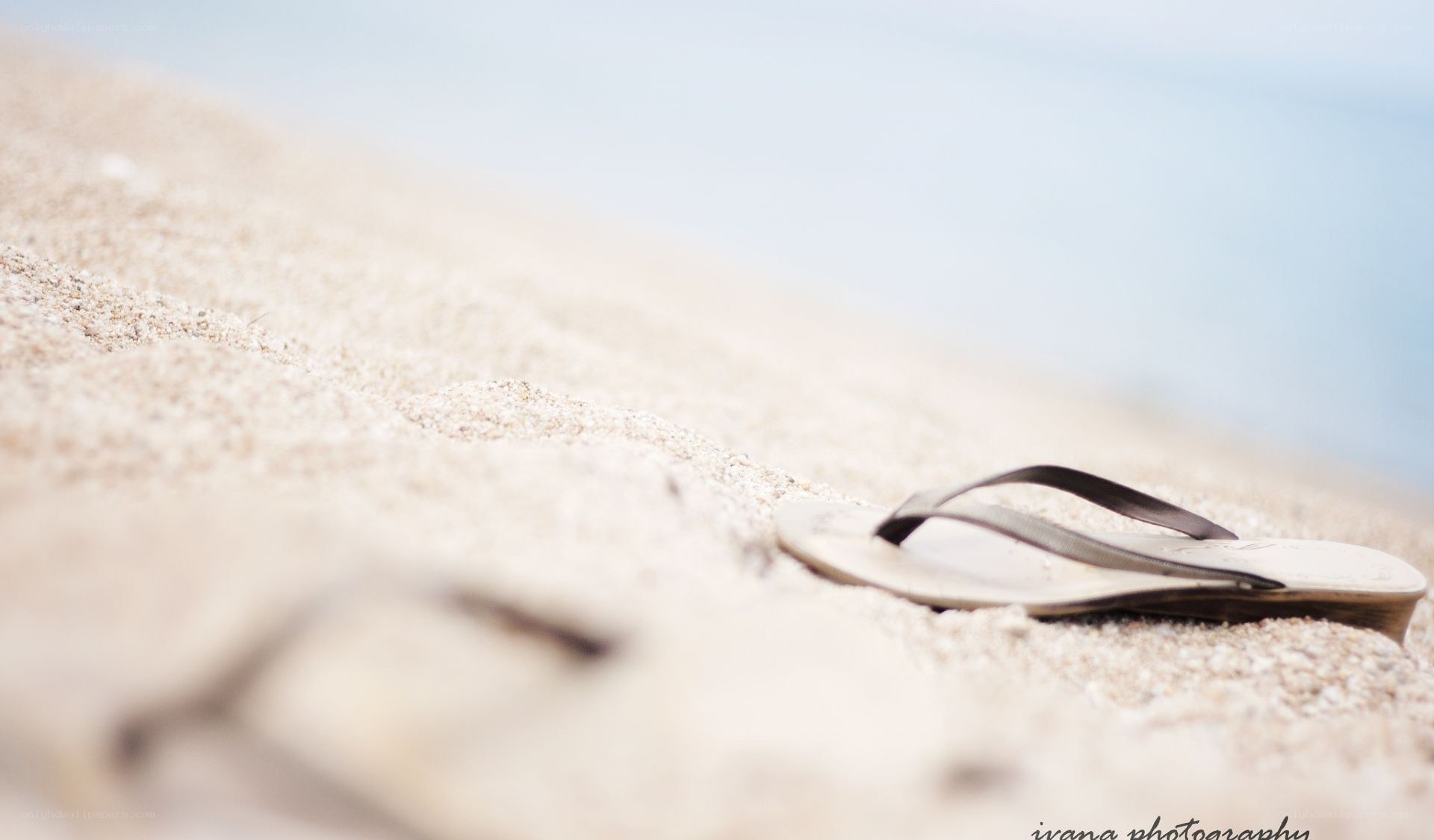 Flip-flops on a sandy beach
