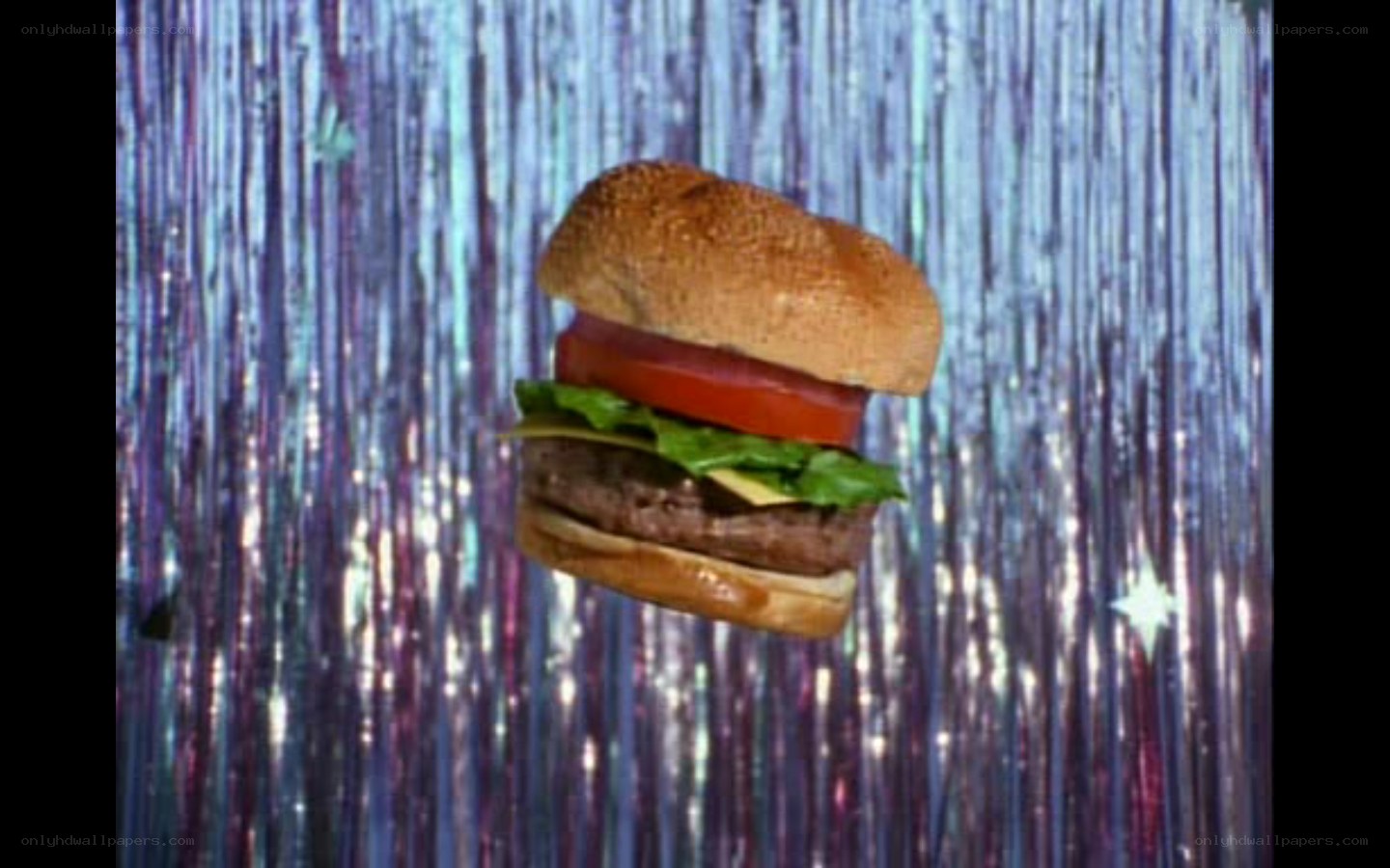 floating burger on tinsel background