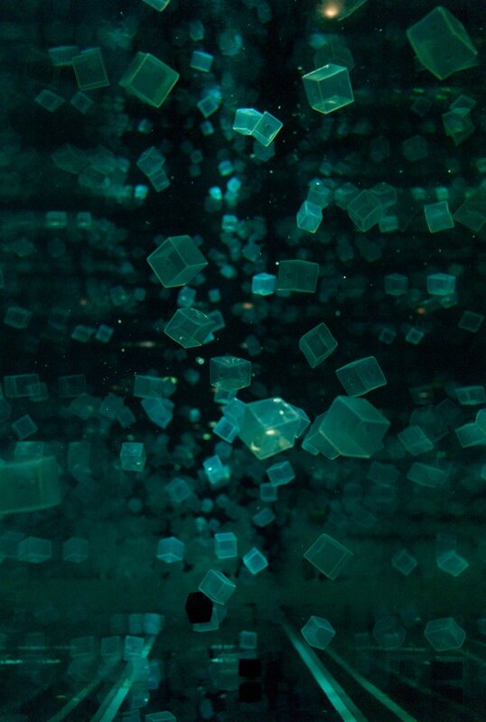 Floating cubes in dark liquid