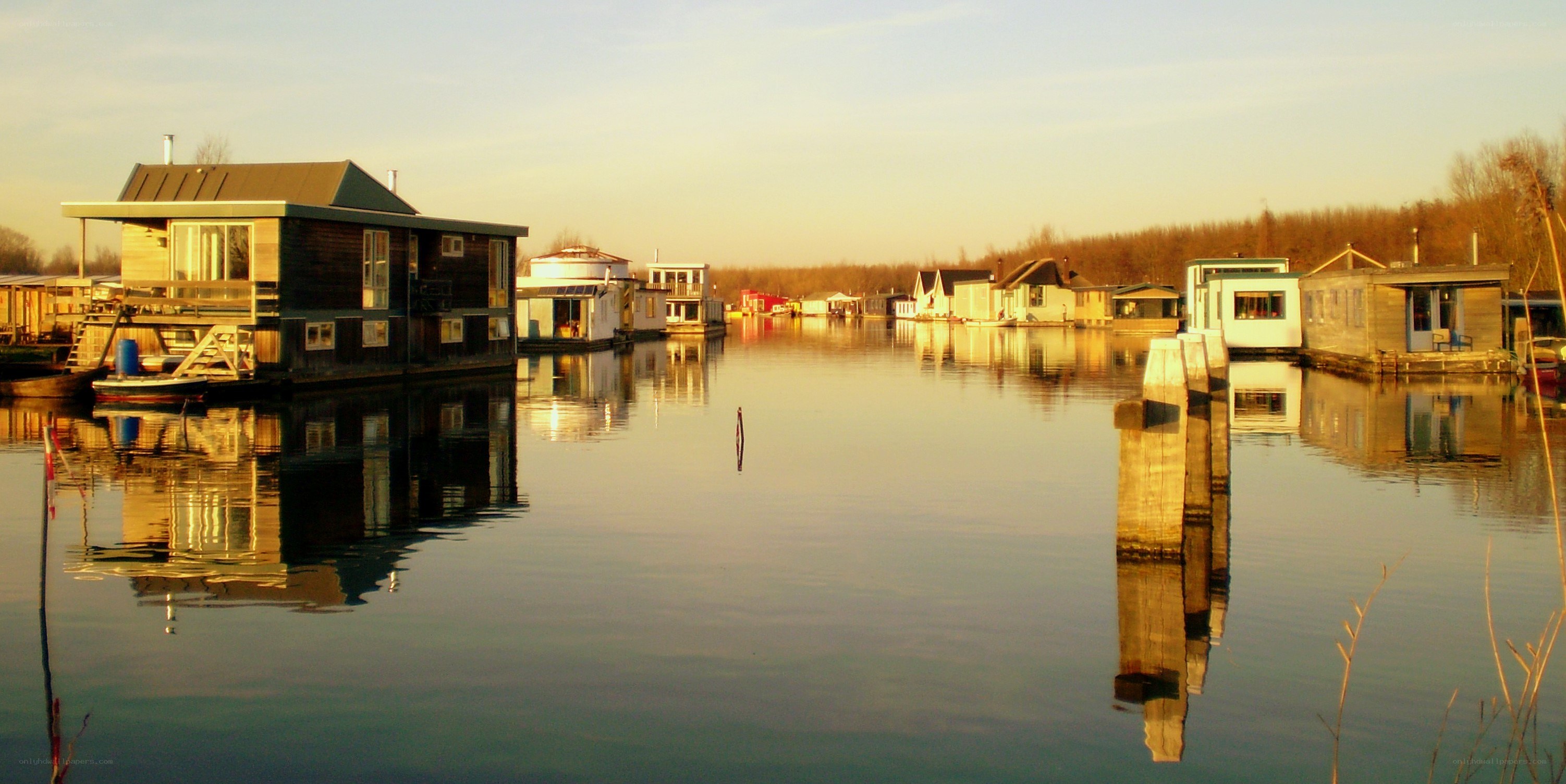 Floating homes on a calm waterway