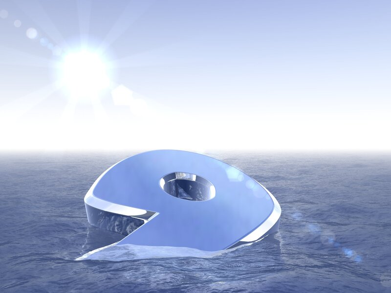 Floating number nine in ocean