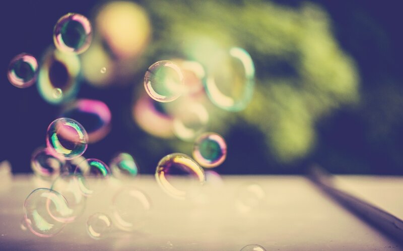 Floating soap bubbles in sunlight