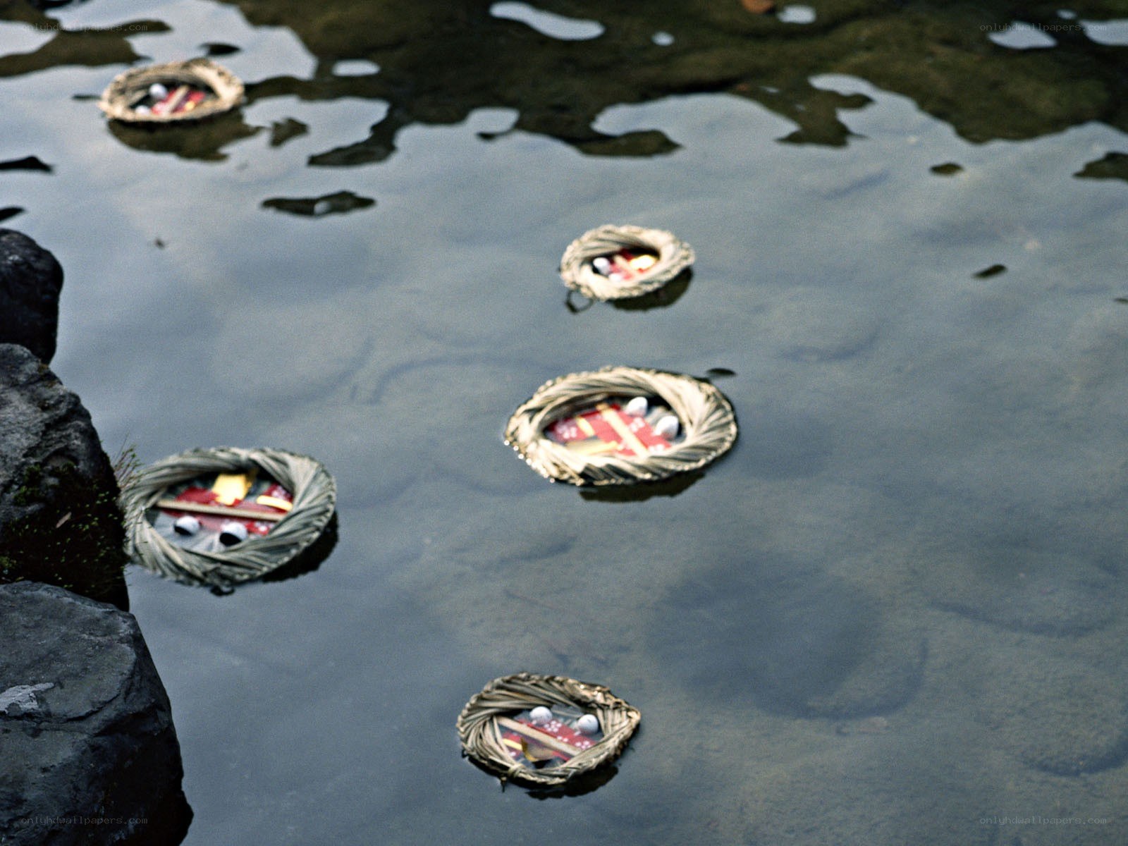 Floating woven baskets on water