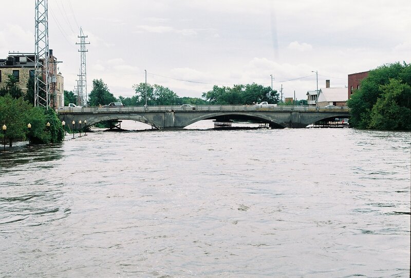 Flooded bridge over river