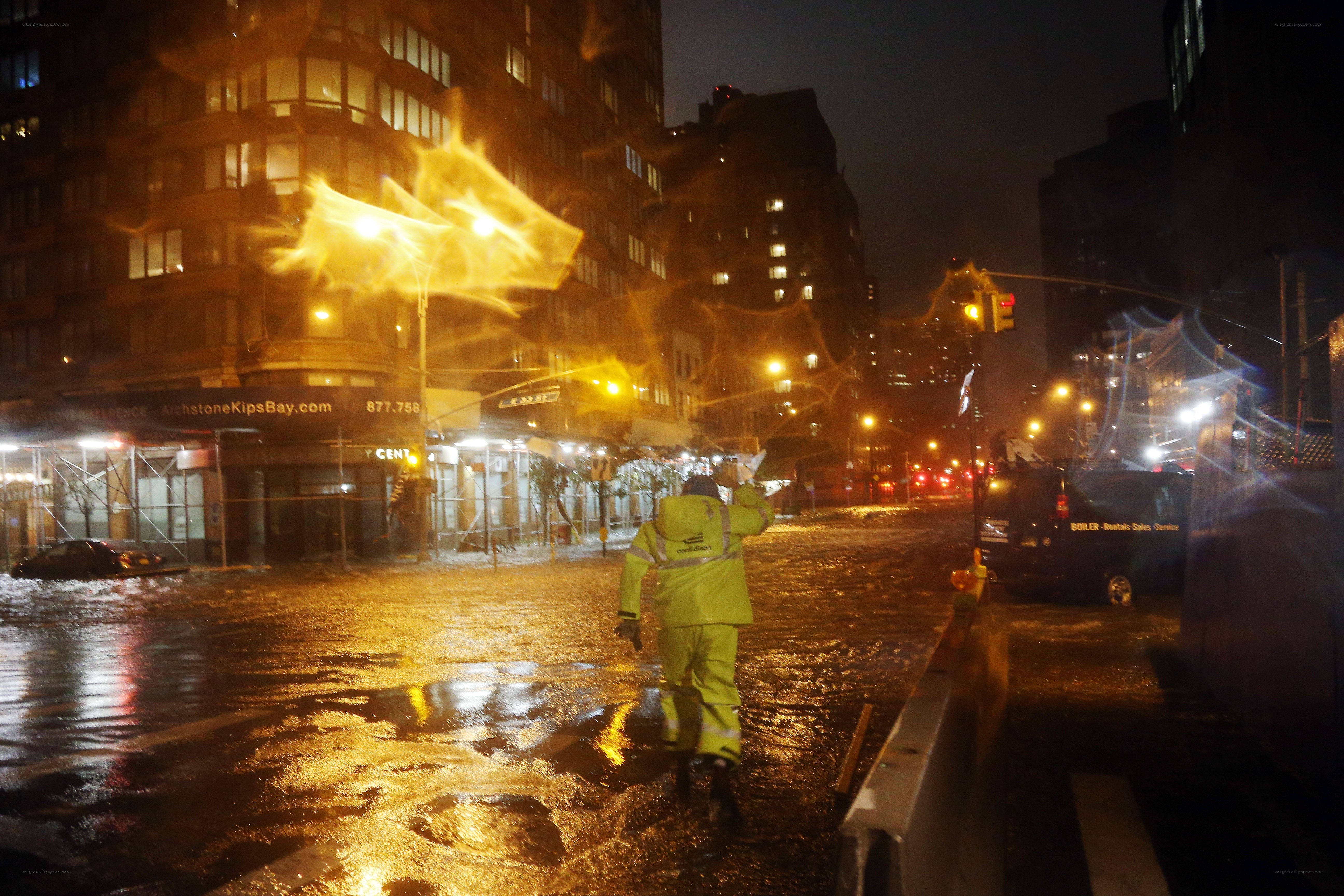Flooded city street at night
