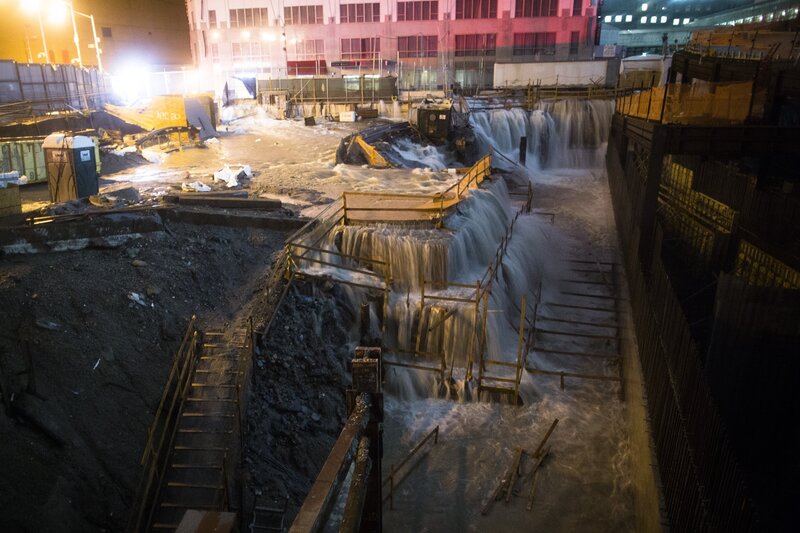 Flooded construction site at night