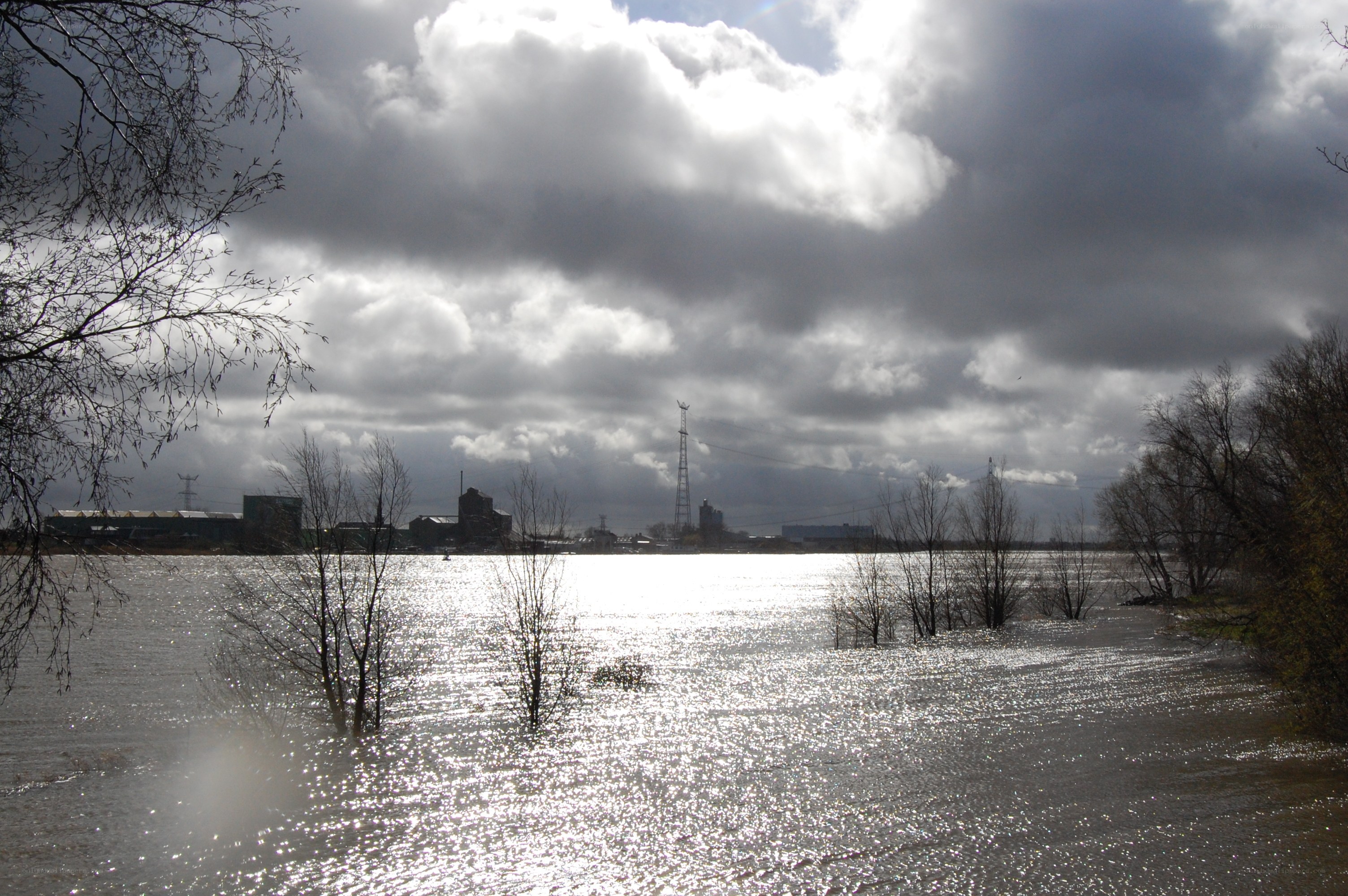 Flooded landscape with industrial backdrop