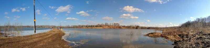 Flooded landscape with power pole