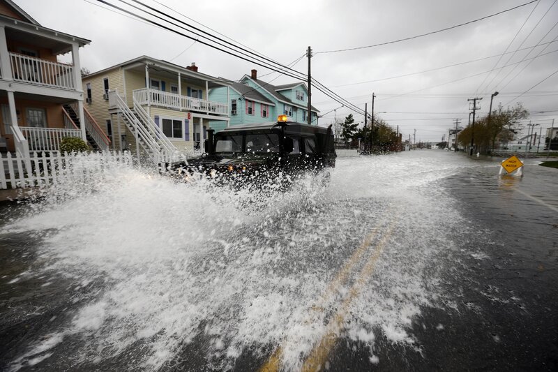 Flooded street with military vehicle