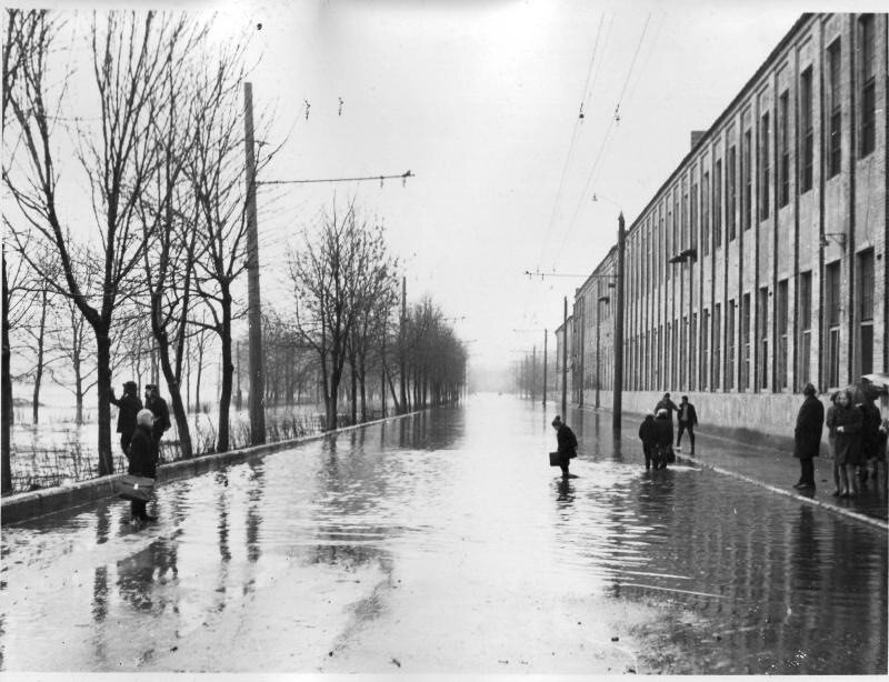 Flooded street with people
