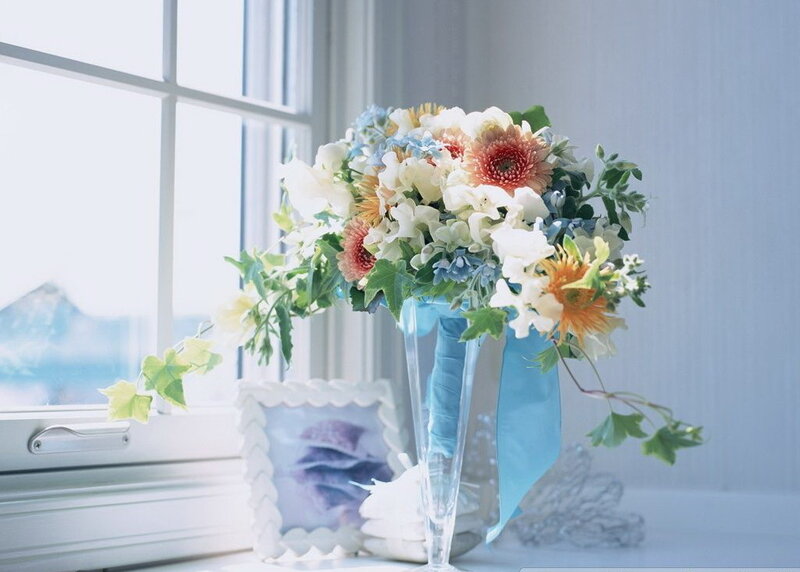Floral arrangement by window