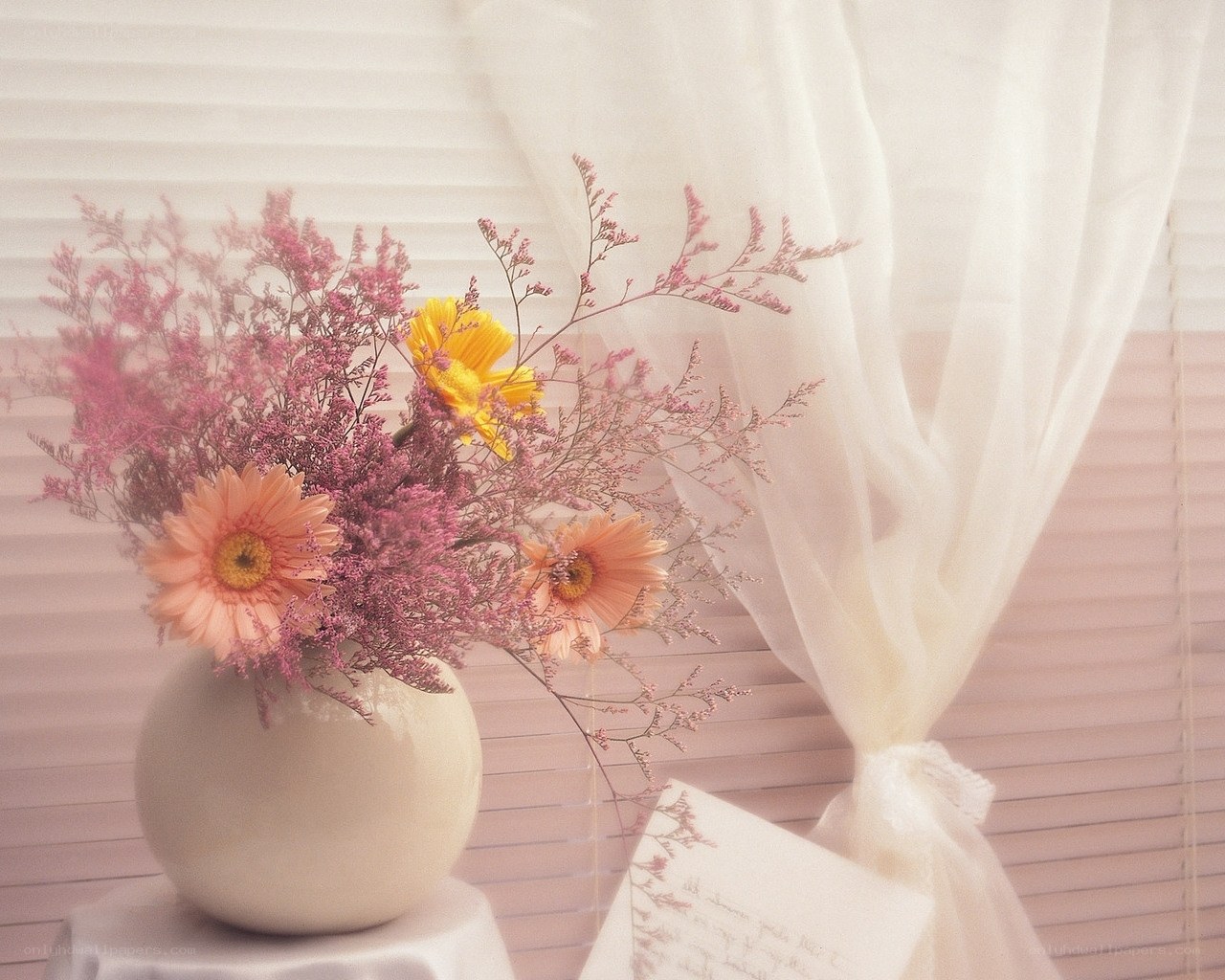 Floral arrangement by window