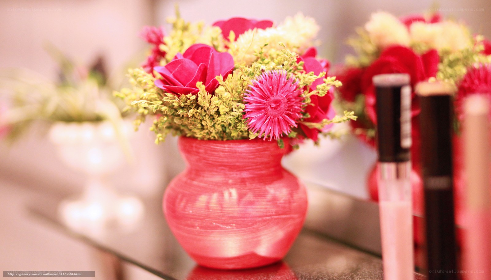 Floral arrangement in red vase