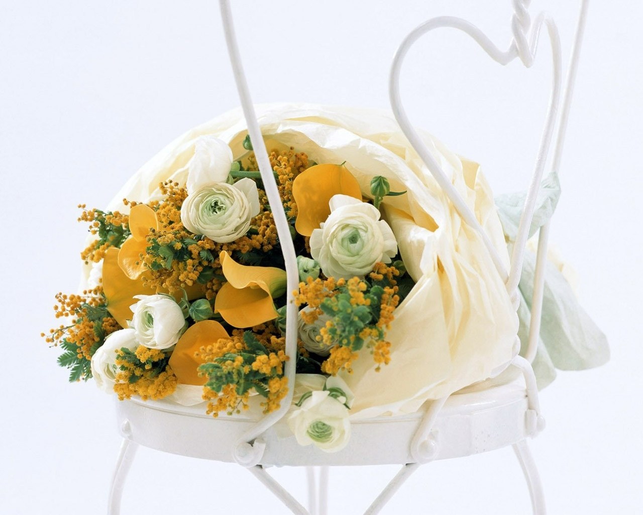 Floral arrangement in white basket