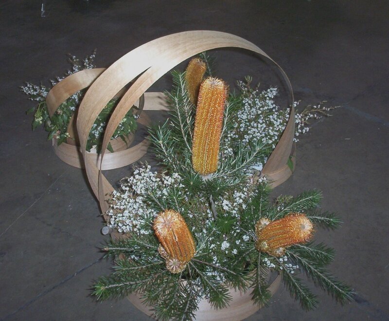 Floral arrangement in wooden basket