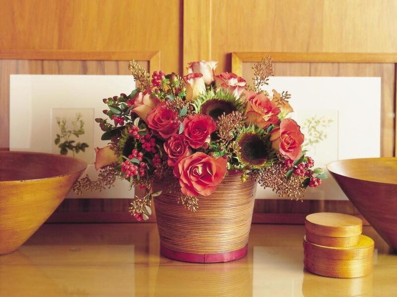 Floral arrangement in wooden vase