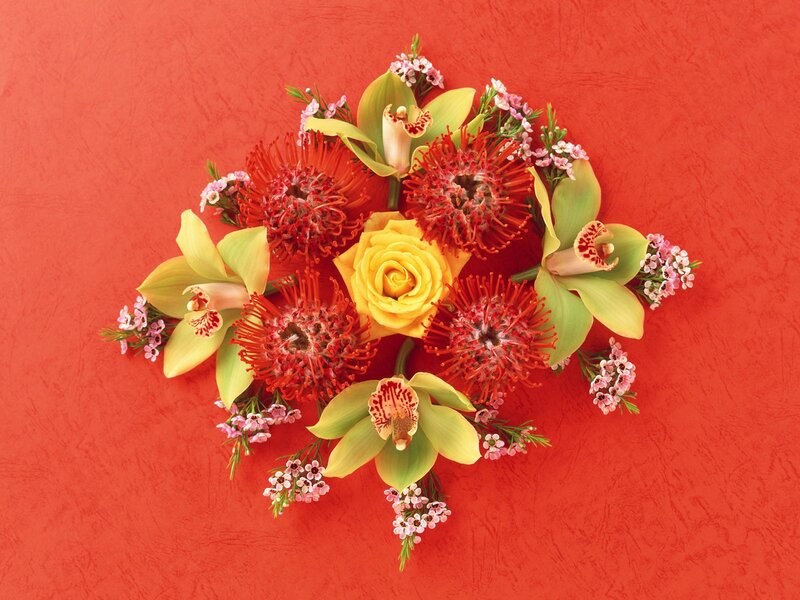 Floral arrangement on red