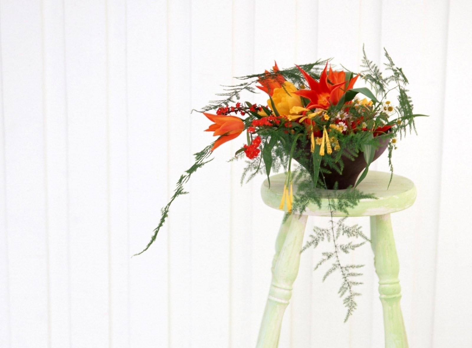 Floral arrangement on stool