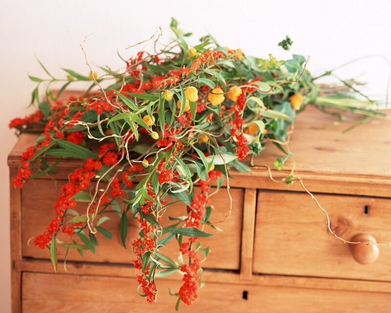Floral arrangement on wooden chest