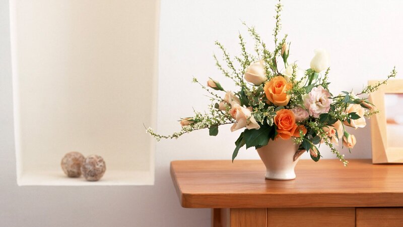 Floral arrangement on wooden table