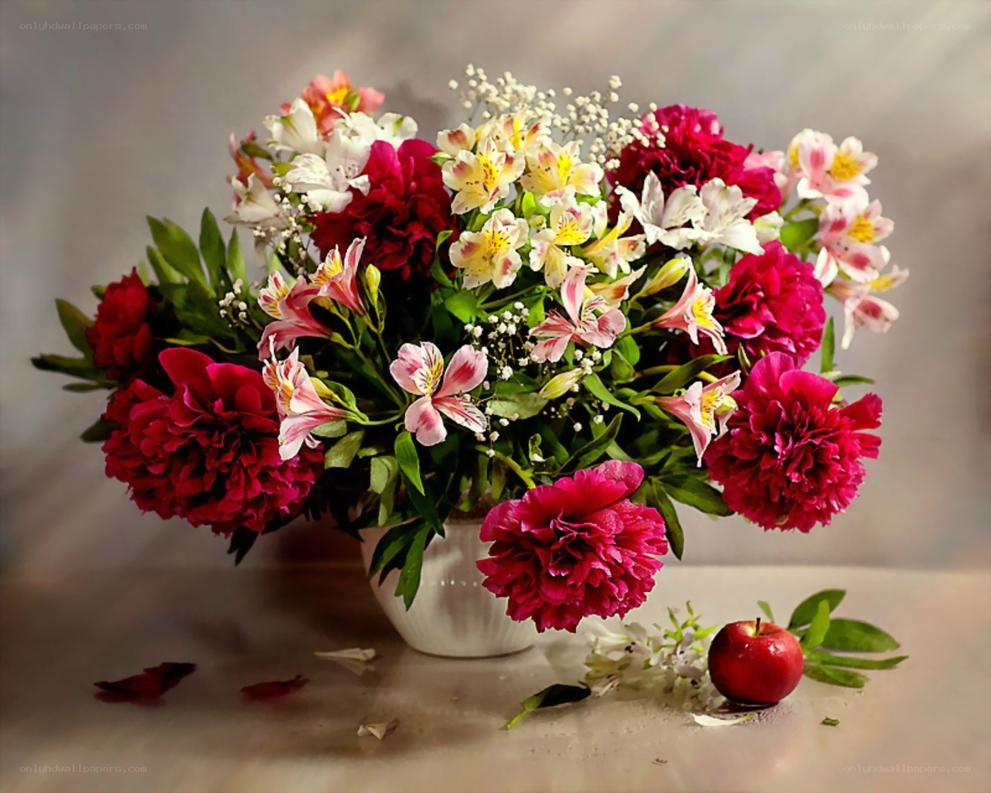 Floral arrangement with apple