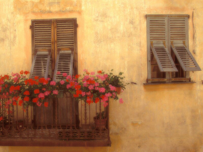 Floral balcony with wooden shutters