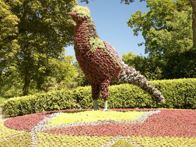 Floral bird sculpture in garden