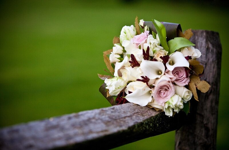 Floral bouquet on wooden fence